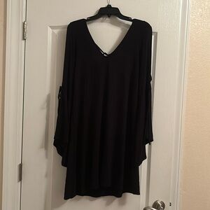 American Eagle black dress with peek a boo shoulders and long sleeves.